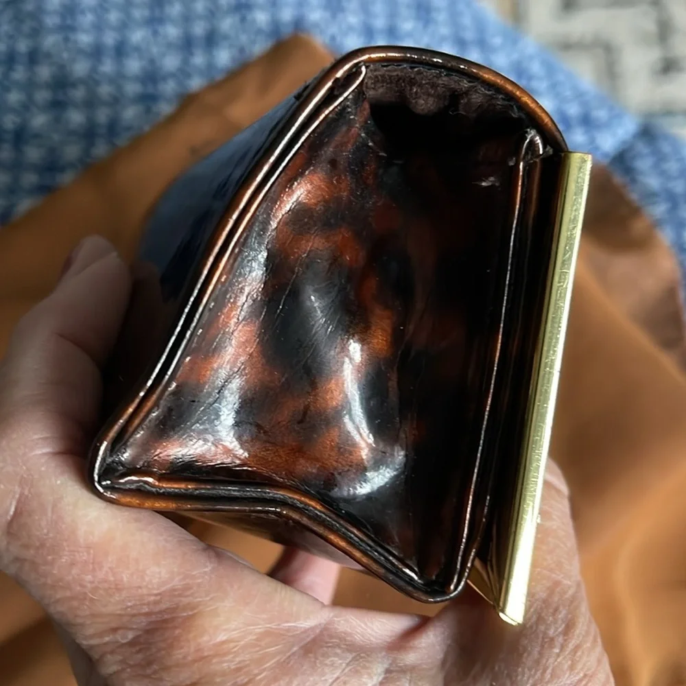 Authentic Tory Burch glass case. Animal print. Magnetic closure. Gold trim . EUC - Picture 6 of 7